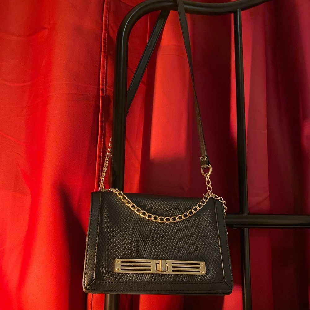 double strap black and gold crossbody bag.